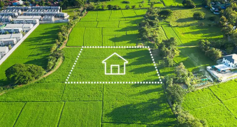 Wie wird der Verkauf von landwirtschaftlichem Grund und Boden in der Schweiz besteuert?